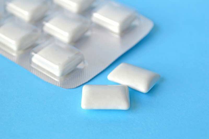 White chewing gum on a blue background